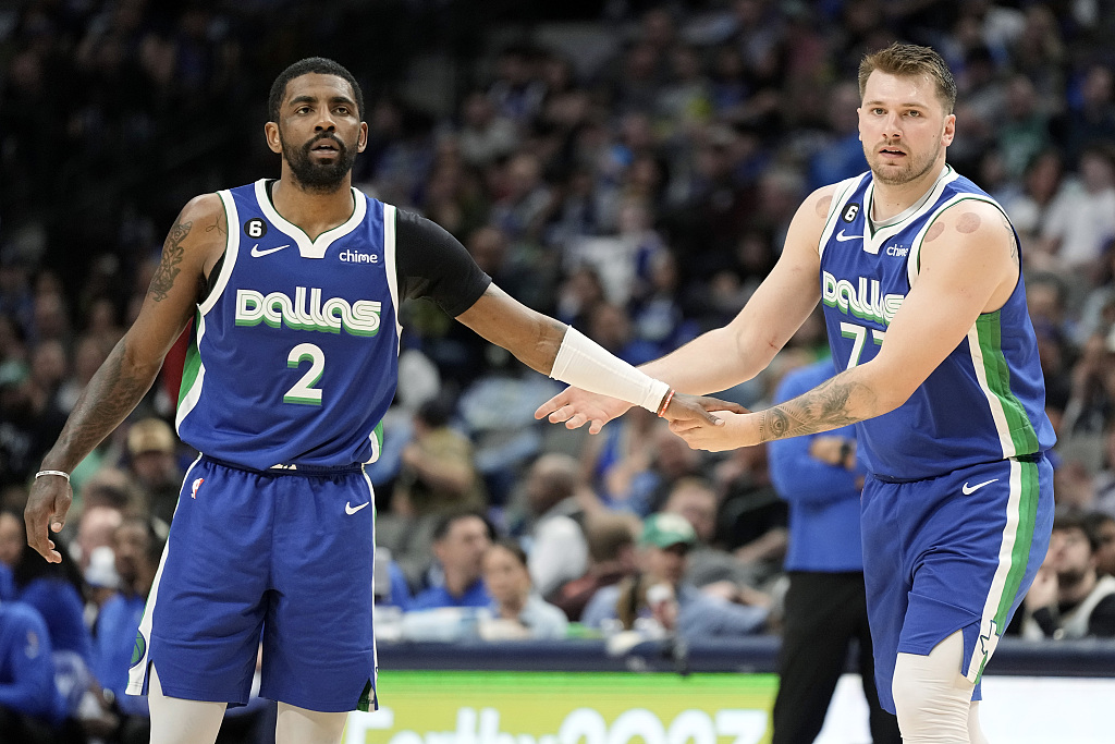 Kyrie Irving (#2) and Luka Doncic of the Dallas Mavericks looks on in the game against the Charlotte Hornets at the Spectrum Center in Charlotte, North Carolina, March 26, 2023. /CFP