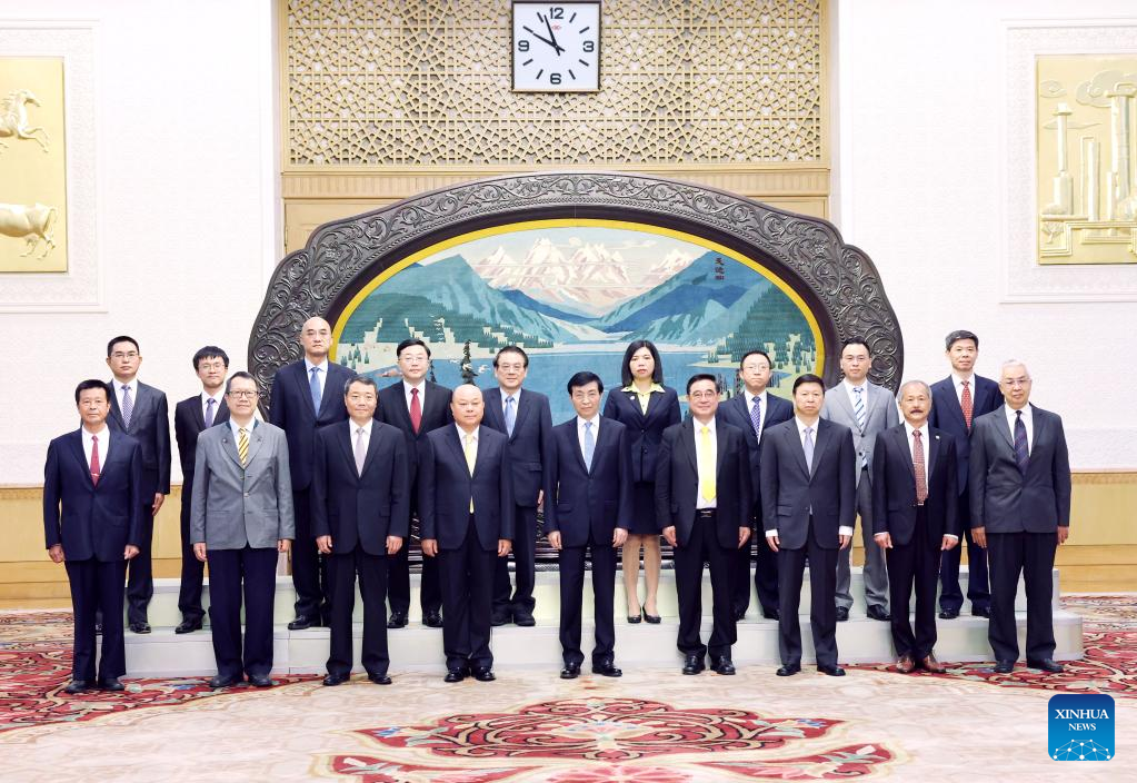 Wang Huning with Wu Cheng-tien and other members coming along, in Beijing, China, June 5, 2023. /Xinhua
