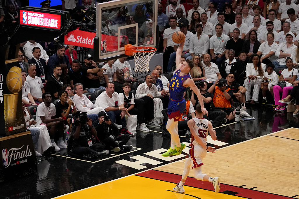 Christian Braun (#0) of the Denver Nuggets dunks in Game 3 of the NBA Finals against the Miami Heat at the Kaseya Center in Miami, Florida, June 7, 2023. /CFP