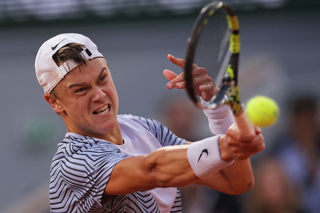 Denmark's Holger Rune plays a forehand return to Norway's Casper Ruud during their men's singles quarter-final at the French Open in Paris, France, June 7, 2023. /CFP