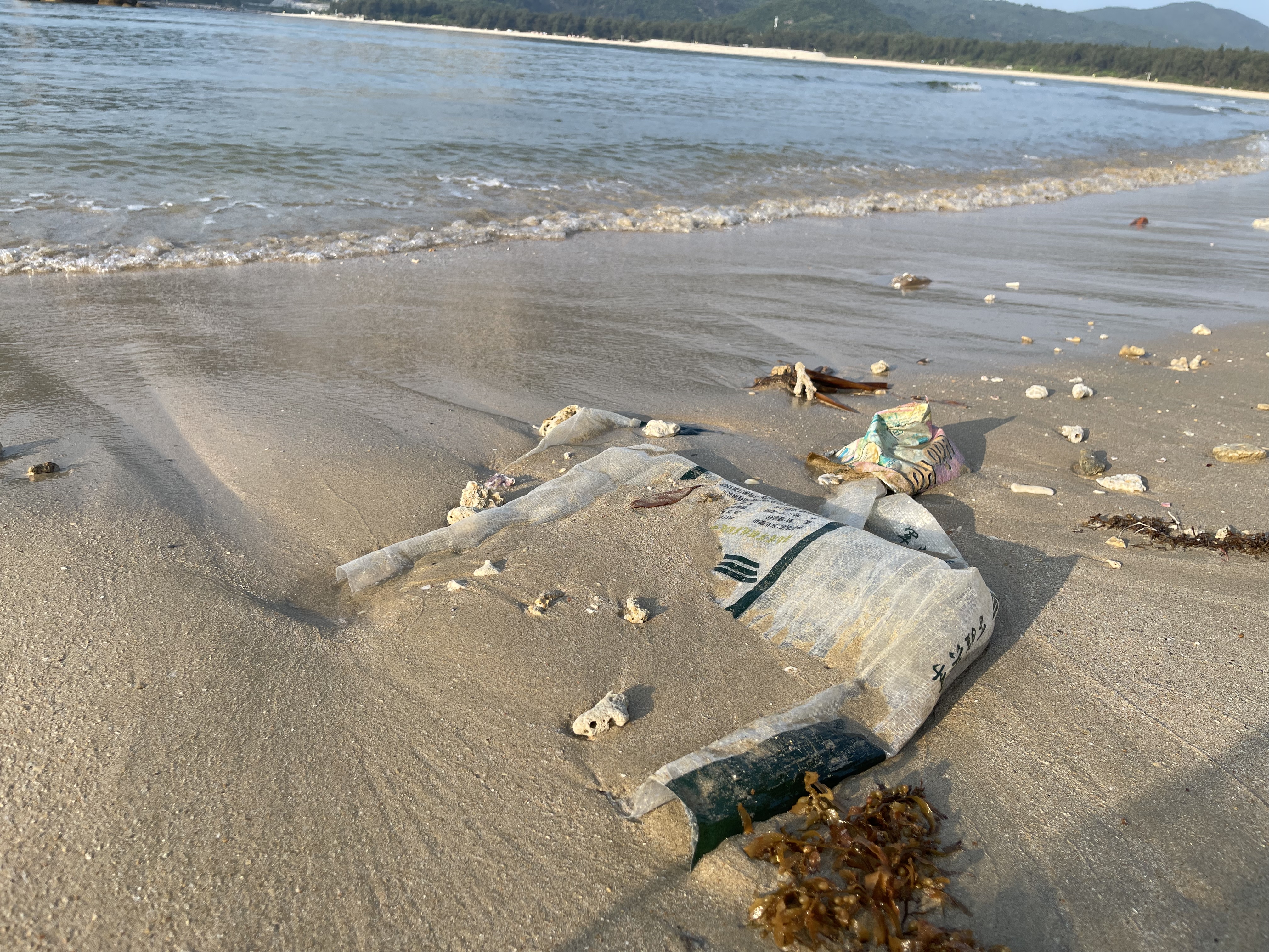 Plastic bags, other garbage on the beach of Houhai Village, Sanya City, Hainan Island, south China. /Blue Ribbon