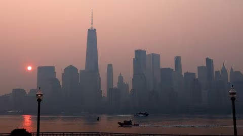 The One World Trade Center tower in lower Manhattan in New York City is pictured shortly after sunrise as haze and smoke caused by wildfires in Canada hangs over the Manhattan skyline in as seen from Jersey City, New Jersey, U.S., June 8, 2023. /Reuters
