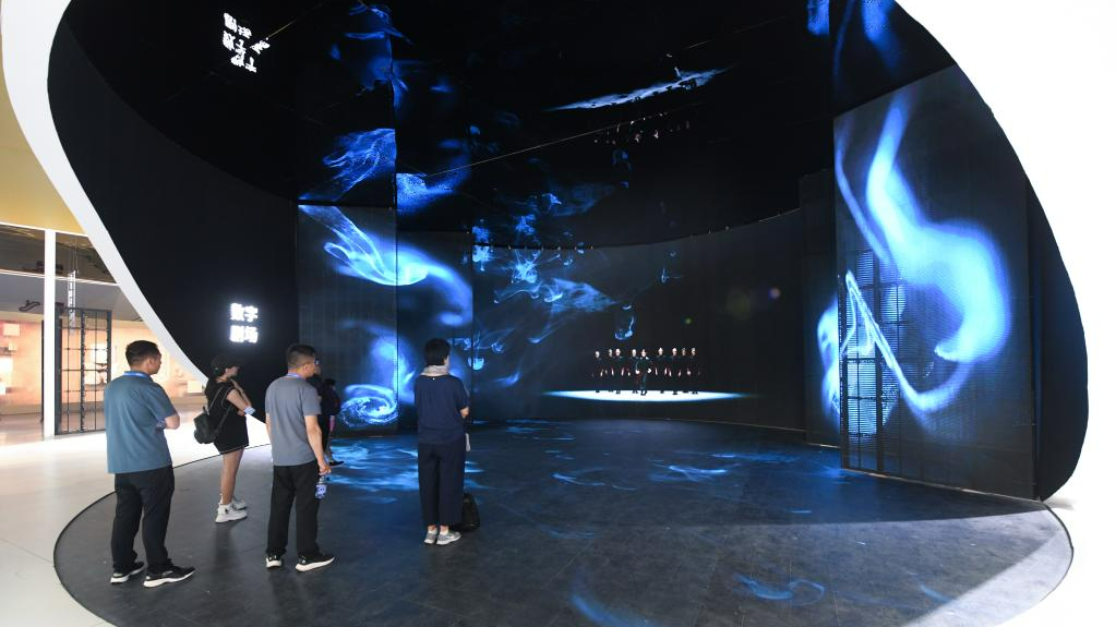 People watch a video at the Digital China exhibition area during the 19th China (Shenzhen) International Cultural Industries Fair in Shenzhen, south China's Guangdong Province, June 8, 2023. /Xinhua