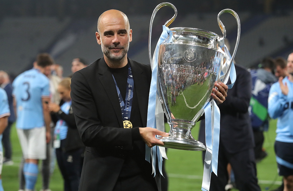 Pep Guardiola, manager of Manchester City, celebrates with the UEFA Champions League trophy after their 1-0 win over Inter Milan in the tournament's final at the Ataturk Olympic Stadium in Istanbul, Türkiye, June 10, 2023. /CFP