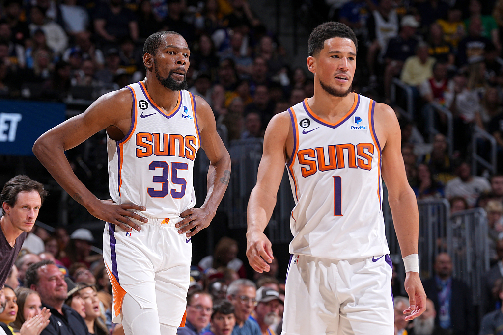 Kevin Durant (#35) and Devin Booker of the Phoenix Suns look on in Game 2 of the NBA Western Conference semifinals against the Denver Nuggets at Ball Arena in Denver, Colorado, May 1, 2023. /CFP