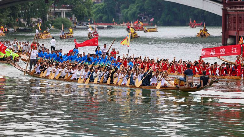 Several teams fiercely compete in a dragon boat race in Tongren City, Guizhou Province on June 12, 2023. /CFP