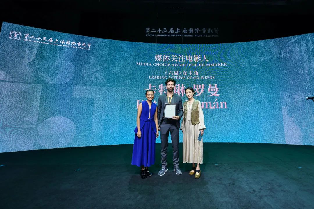 A crew member (center) of the 