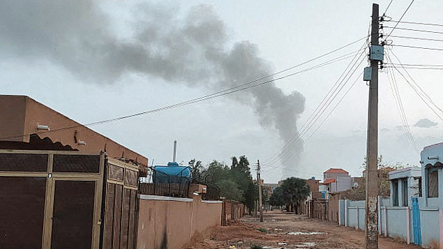 Smoke billows in the distance amid ongoing fighting in Khartoum, June 13, 2023. /CFP