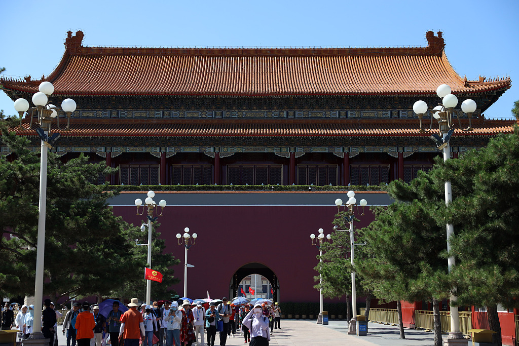 A large number of tourists gather outside the Forbidden City, waiting to have their tickets checked and enter the scenic area for sightseeing in Beijing, China on June 13, 2023. /CFP