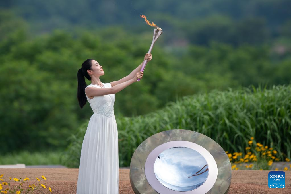 The flame is lit during the Hangzhou 2022 Asian Games Flame Lighting Ceremony at the Archaeological Ruins of Liangzhu City park in Hangzhou, east China's Zhejiang Province, June 15, 2023. /Xinhua 