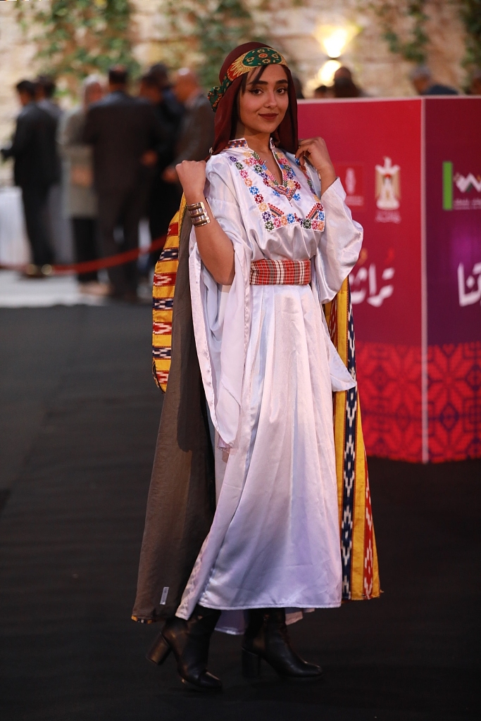 A woman models a traditional embroidered garments at an event held to celebrate the inclusion of Palestinian embroidery in UNESCO's Representative List of Intangible Cultural Heritage of Humanity, March 9, 2022, Ramallah, West Bank, Palestine. /CFP