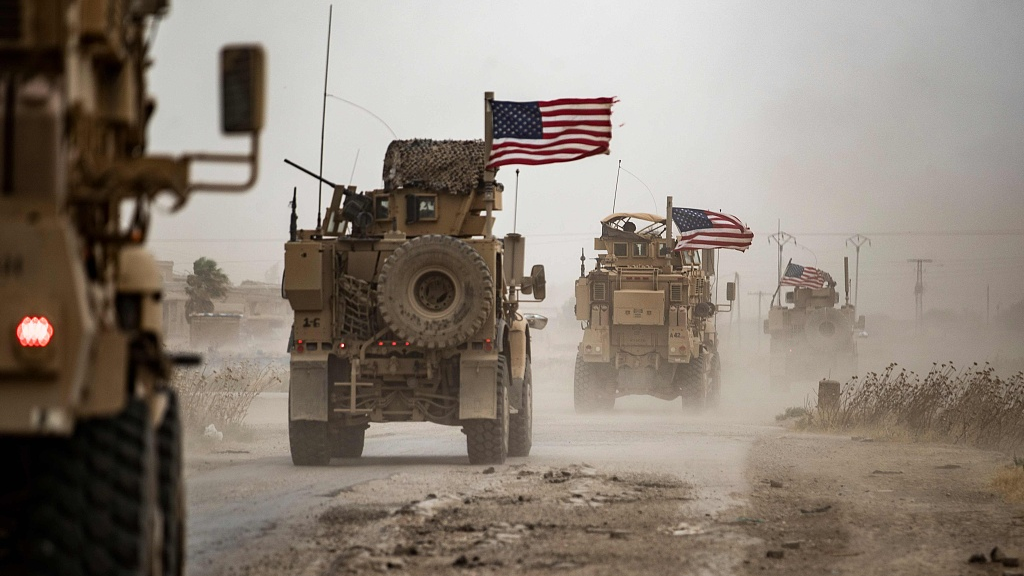 U.S. military vehicles drive pass the oil-rich town of Rumeilan in the al-Hasakah Governorate in the northeast of Syria, July 1st, 2020. /CFP