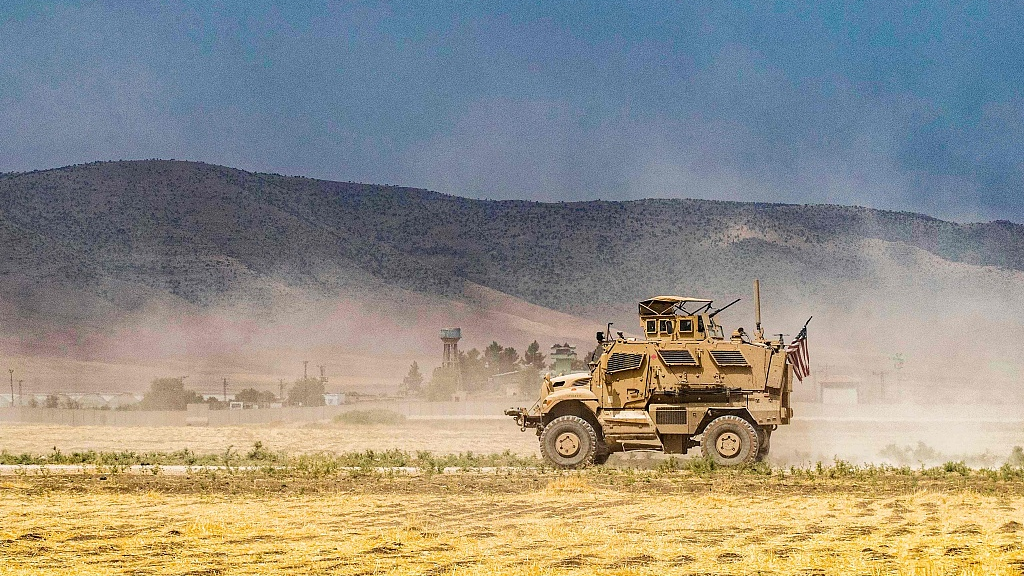 A U.S. military vehicle drives in one of the villages that was subject to bombardment the previous week in the countryside east of Qamishli in Syria's northeastern Hasakah province, August 21, 2022. /CFP