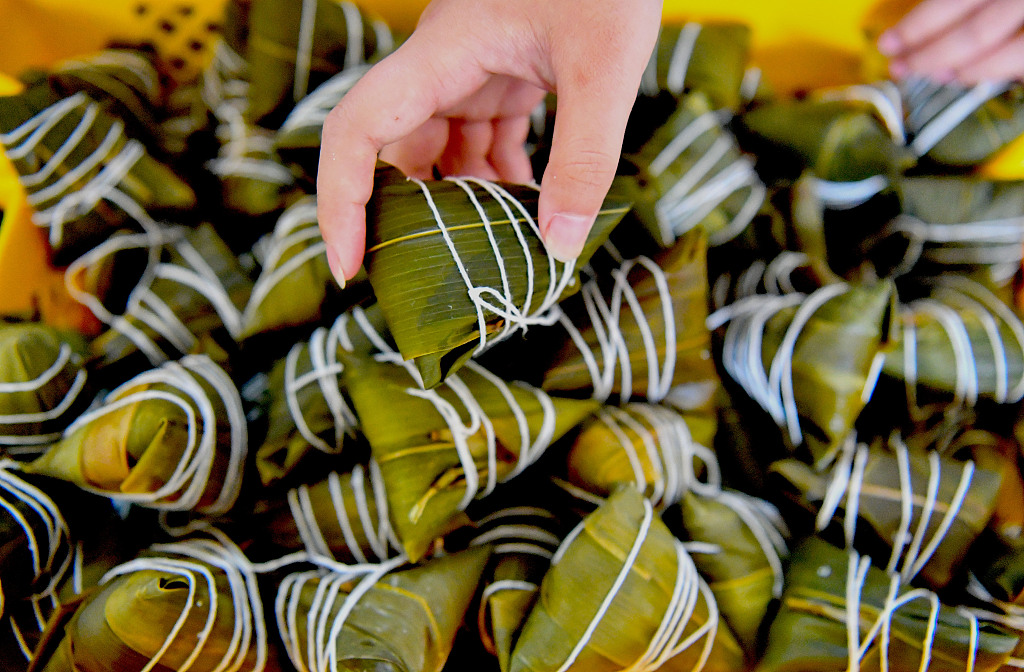 Residents of a village make zongzi together to prepare for the upcoming Dragon Boat Festival in Bozhou city, Anhui Province, on June 16, 2023. /CFP