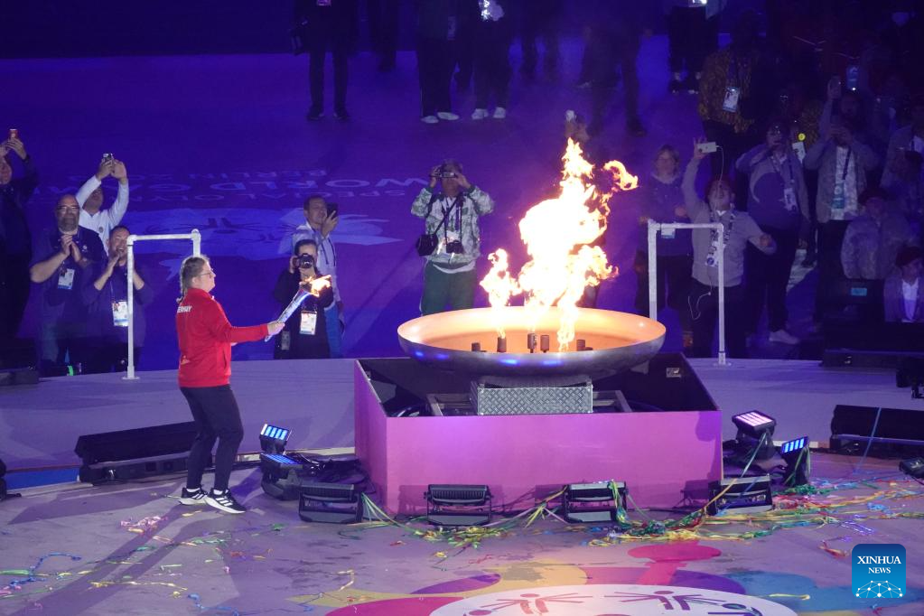 German athlete Sophie Rensmann carries the torch after lighting the Special Olympics cauldron during the opening ceremony of the 2023 Special Olympics World Games in Berlin, Germany, June 17, 2023. /Xinhua