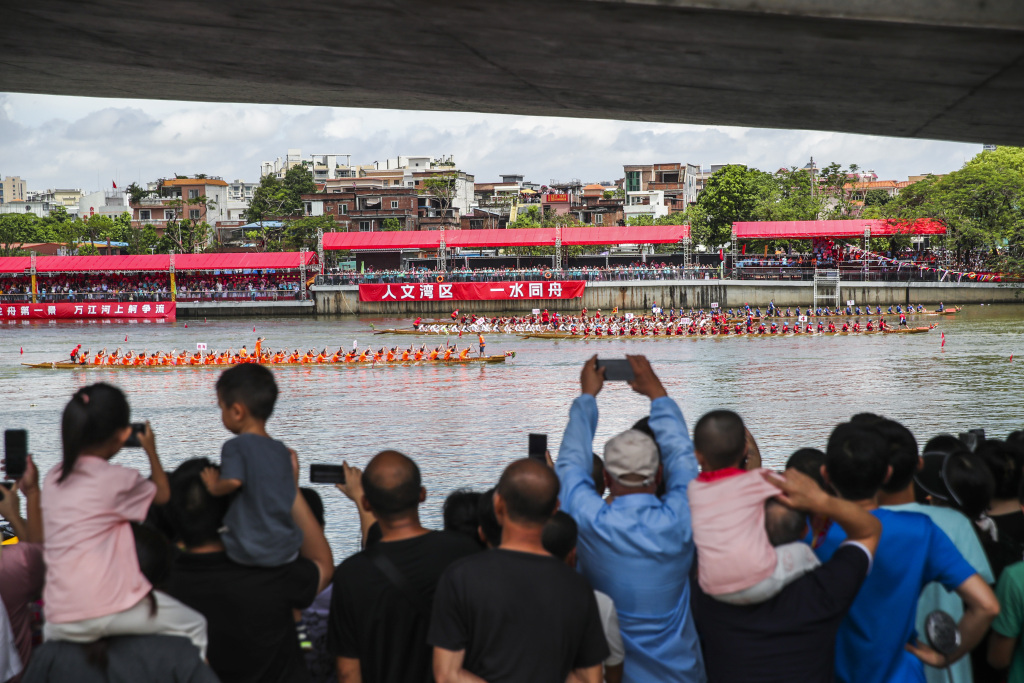 A dragon boat race is held in Dongguan, south China's Guangdong Province, June 18, 2023. /CFP