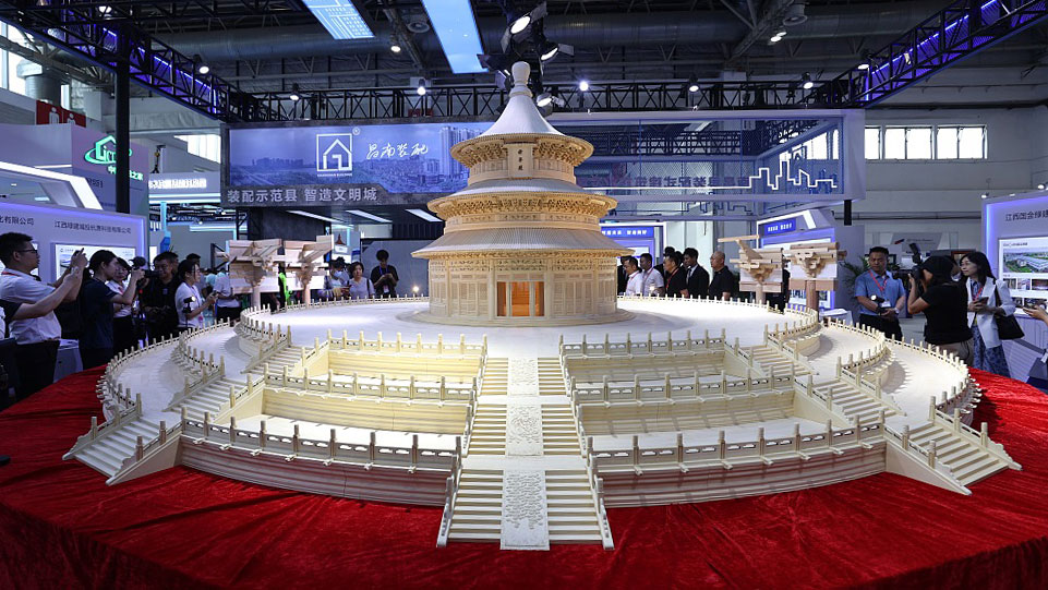 A model of the Qinian Palace in Beijing's Temple of Heaven is displayed at the 20th China International Housing Industry Expo, Beijing, China, June 19, 2023. /CFP