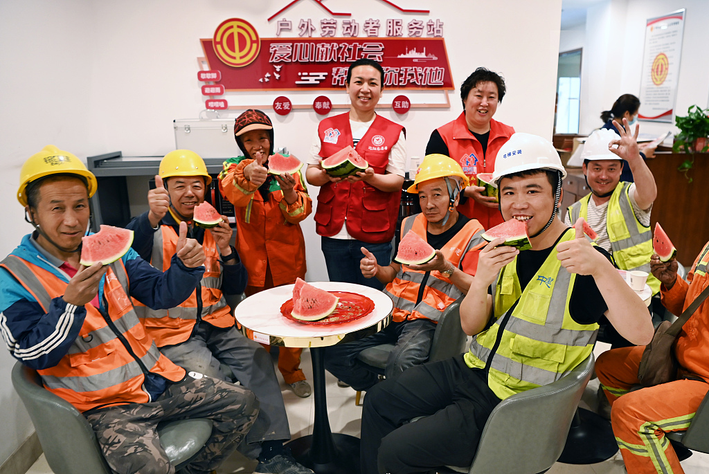 Service station for outdoor workers provides them watermelon and other supplies, Shenyang City, northeast China's Liaoning Province, June 14, 2023. /CFP