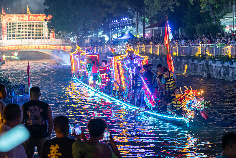 A dragon boat cruises on a river in Foshan City, Guangdong Province, June 19, 2023. /CFP