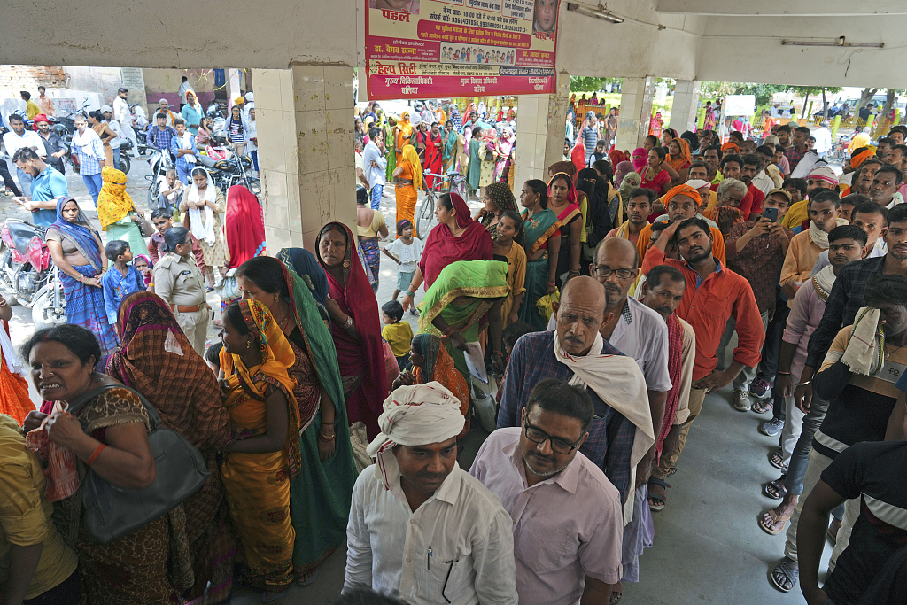 People stand in queue to register outside district hospital in Ballia, Uttar Pradesh, India, June 19, 2023. /CFP