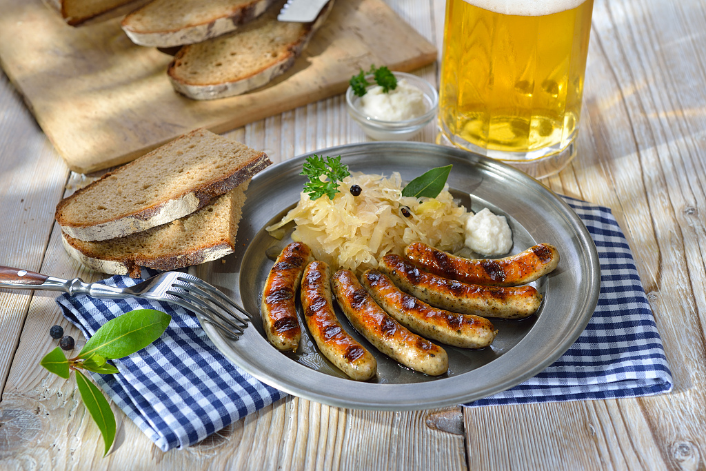 Sauerkraut alongside sausages. /CFP