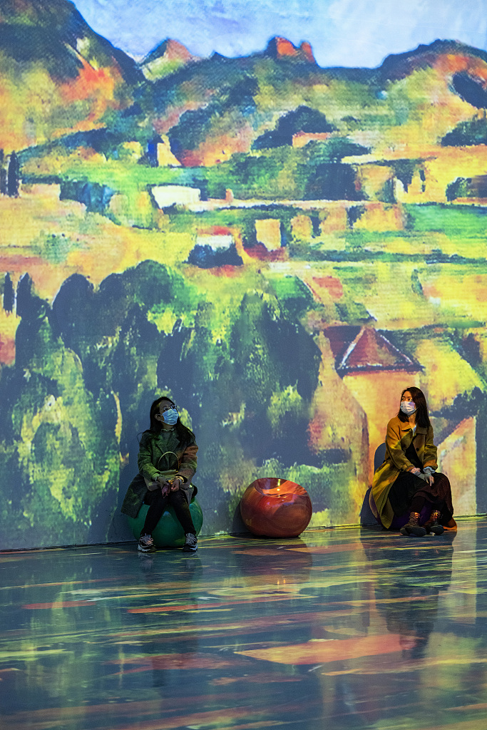 An oil painting by Paul Cezanne is projected onto a wall at an exhibition in Beijing, March 24, 2023. /CFP
