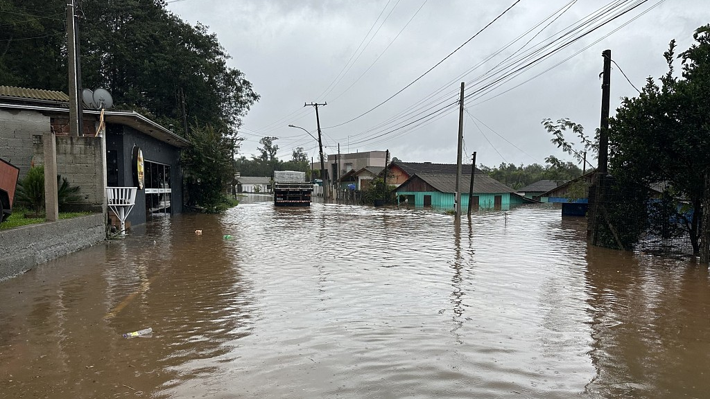 A truck drives through a flooded street in the city of Lindolfo Collor, Rio Grande do Sul State, after an extratropical cyclone hit the southern region of Brazil, June 17, 2023. /CFP