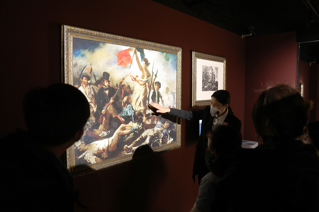 Visitors view prints from the Louvre Chalcographie at an exhibition at the Meet You Museum in Beijing, January 12, 2023. /CFP