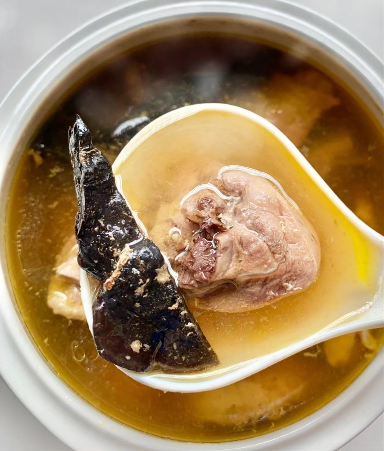 An undated photo shows chicken soup with Lingzhi mushrooms, a specialty in the city of Wuzhishan, Hainan Province. /Photo provided to CGTN