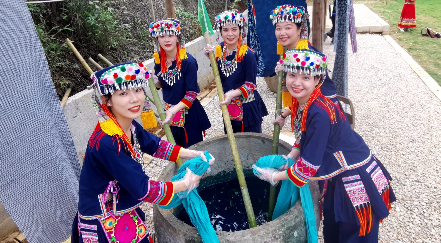 Yao people complete steps in the process of cloth dyeing in Hechi of south China's Guangxi Zhuang Autonomous Region, on April 23, 2023. /CNSPHOTO