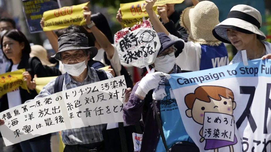 Dozens of protesters gather for a rally outside Tokyo Electric Power Company Holdings (TEPCO) headquarters building Tuesday, May 16, 2023. /CFP