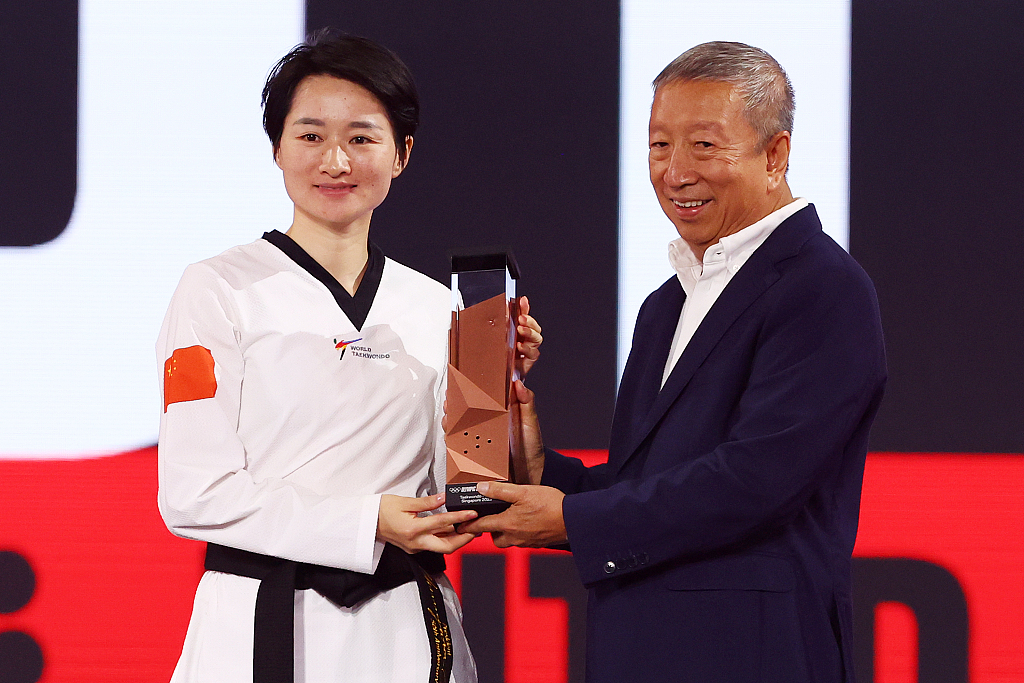 Wu Jingyu (L) of China finishes the Virtual Taekwondo event third in the Olympic Esports Series in Singapore, June 25, 2023. /CFP 