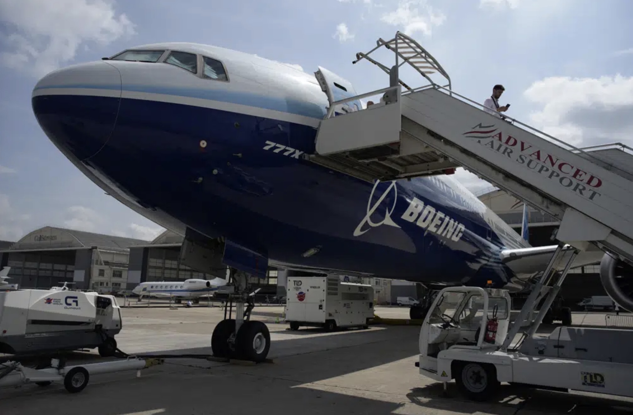 A man walks down the steps of the Boeing 777X airplane during the Paris Air Show in Le Bourget, north of Paris, France, June 19, 2023. /AP