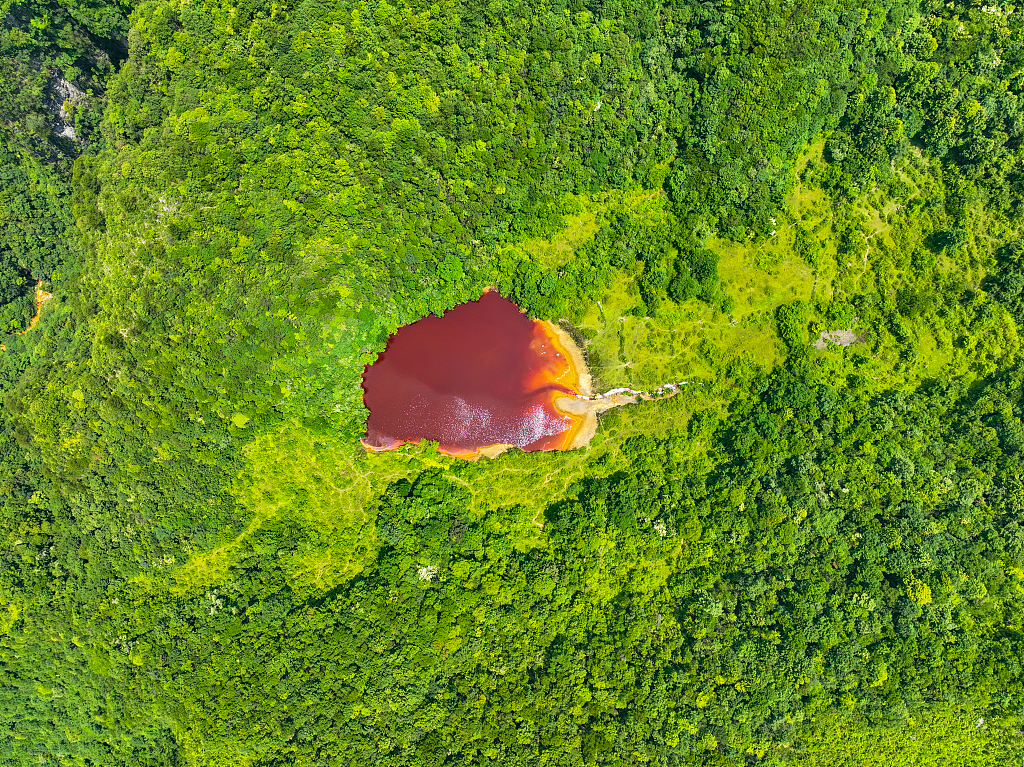 An aerial view of the crimson lake atop Baire mountain in Longli, Guizhou, China, June 26, 2023. /CFP
