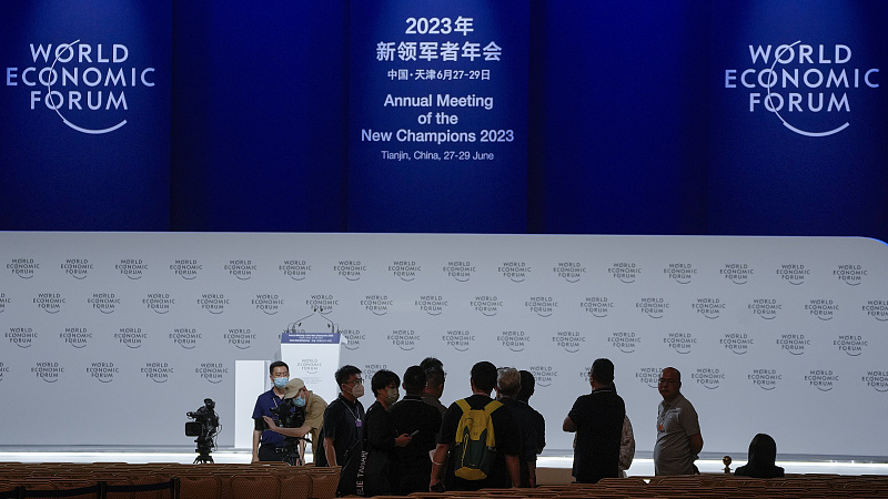 Members of the official media set up their camera position at the plenary hall of the Meijiang Convention and Exhibition Center ahead for the World Economic Forum's Annual Meeting of the New Champions 2023 in China's Tianjin Municipality, June 26, 2023. /CFP