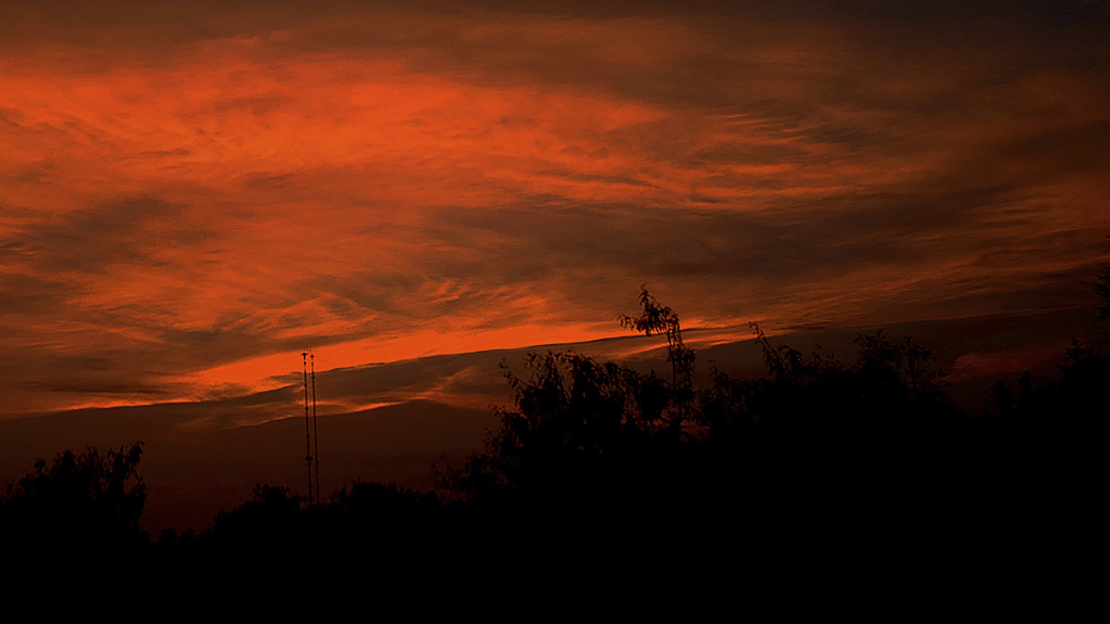 The sun sets northwest of Edinburg, Texas, June 15, 2023. The National Weather Service in Brownsville-RGV-station announced an 