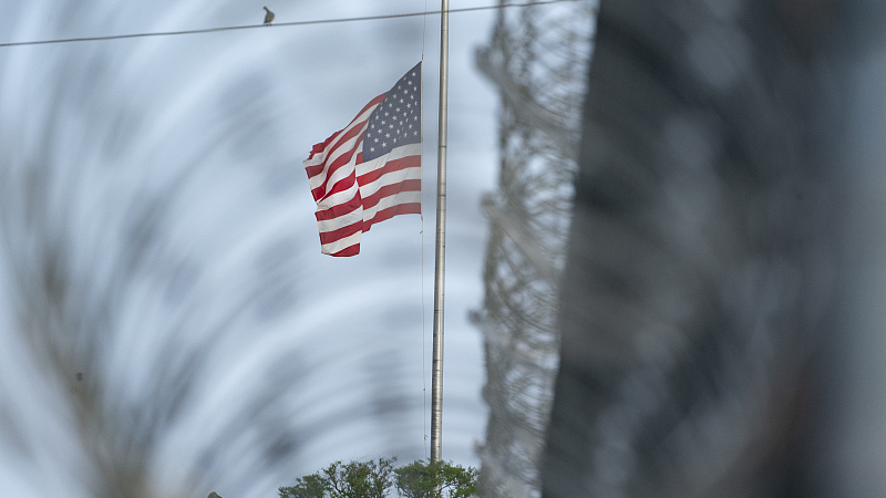 A U.S. national flag flies at half-staff as seen from Camp Justice in Guantanamo Bay Naval Base, Cuba, August 29, 2021. /CFP