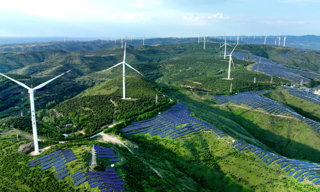 A wind power plant is seen in the mountains of Huanglong County in Yan'an, northwest China's Shaanxi Province. /CFP