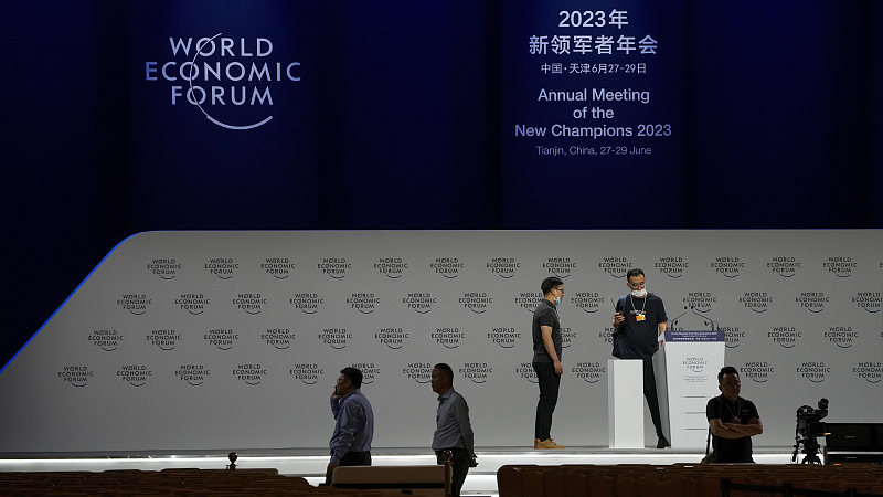 Workers check on the stage setup ahead for the World Economic Forum's Annual Meeting of the New Champions 2023 in China's Tianjin Municipality, June 26, 2023. /CFP