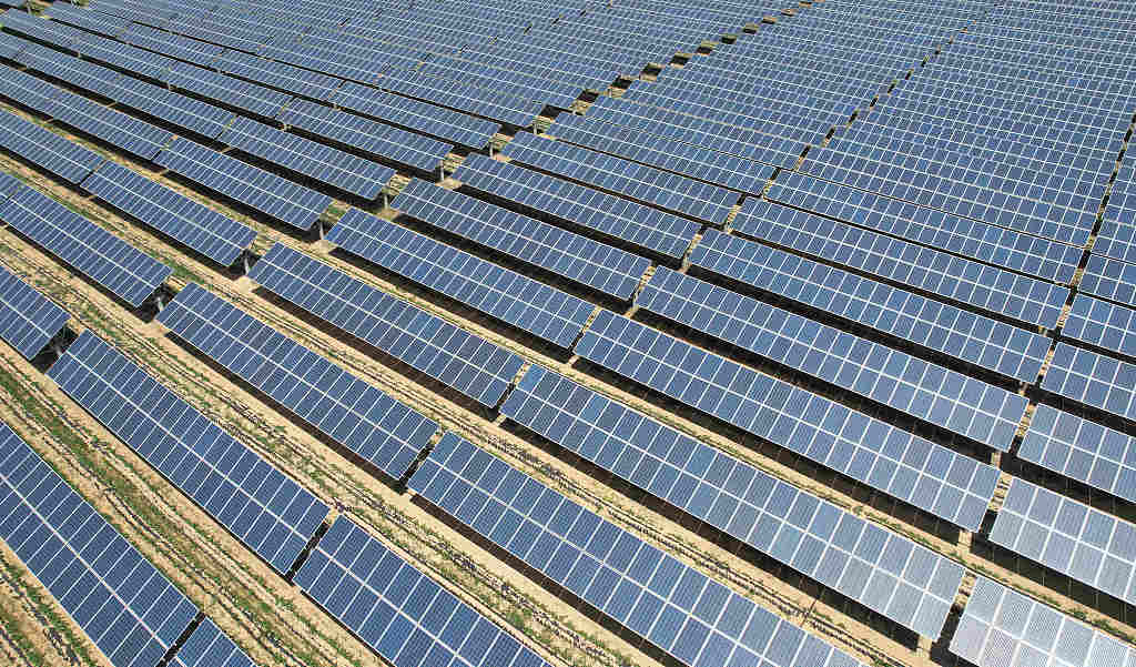 The photo taken on June 8, 2023, shows a photovoltaic power station with a massive array of solar panels built on farmland in a village near Linyi, east China's Shandong Province. /CFP
