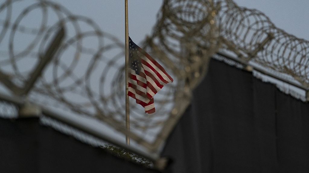 A U.S. national flag flies at half-staff as seen from Camp Justice in Guantanamo Bay Naval Base, Cuba, August 29, 2021. /CFP