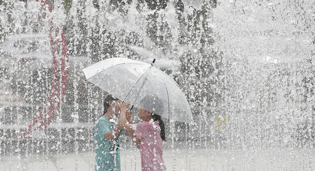 Children playing under a fountain in Daegu, South Korea, June 27, 2023. /CFP