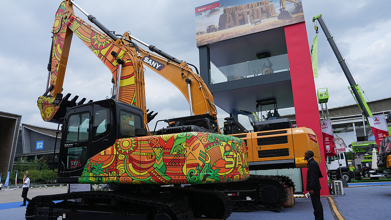 A Chinese excavator imprinted with African-style patterns attracts attention from spectators at the third China-Africa Economic and Trade Expo in Changsha, Hunan Province, June 29, 2023. /CFP