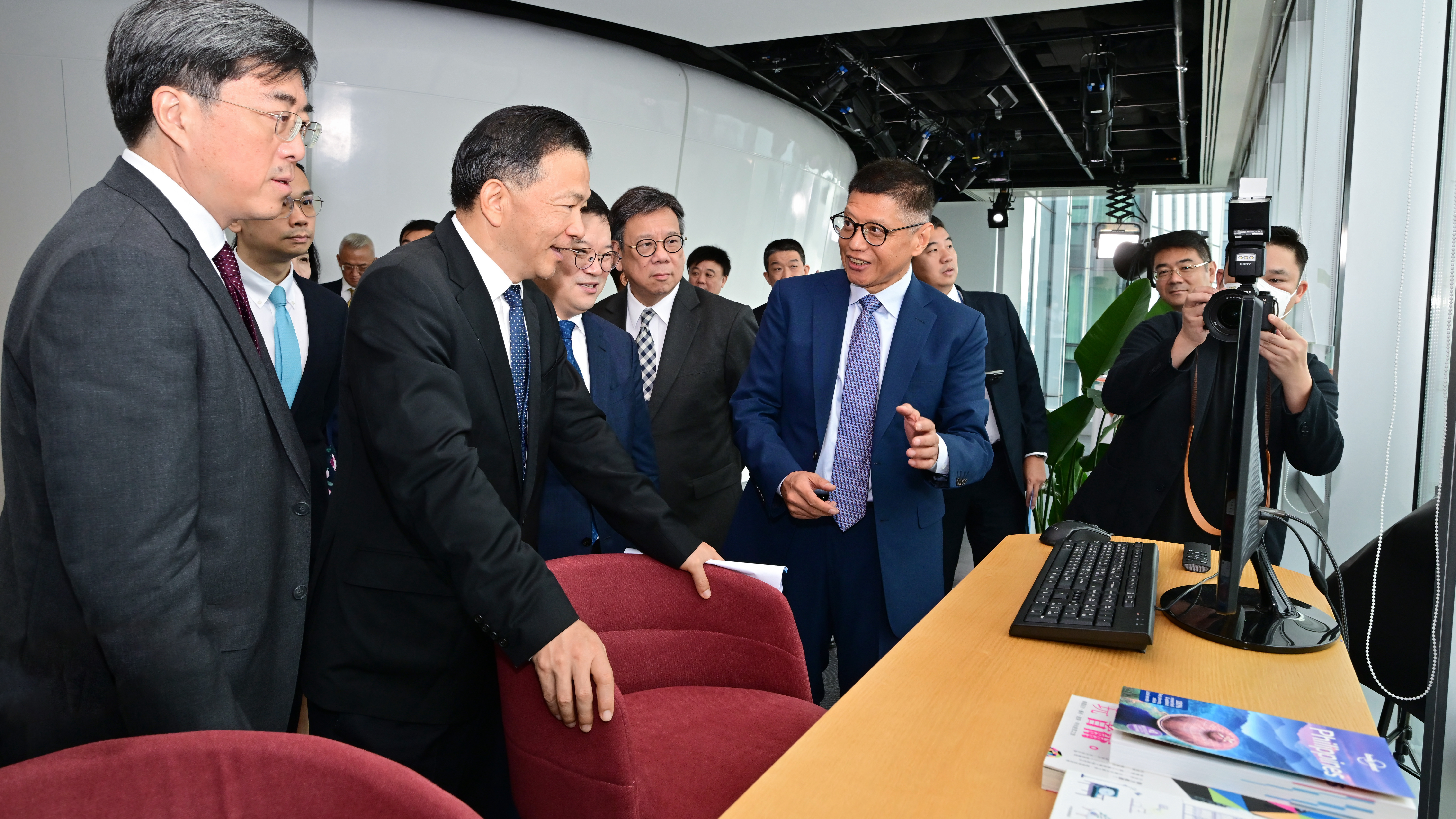 Shen Haixiong (L2) and representatives visiting the Asia-Pacific headquarters of CMG, China's Hong Kong Special Administrative Region, June 30, 2023. /CMG
