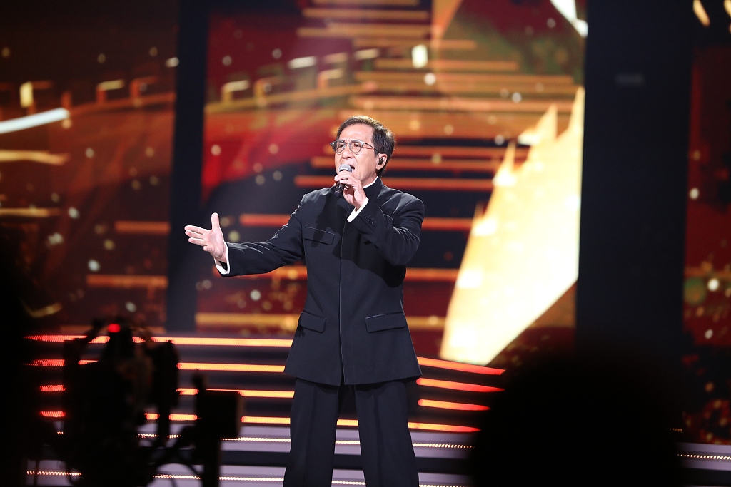 Actor Jackie Chan sings on the stage of the Greater Bay Area Film Concert 2023 in Hong Kong on June 29, 2023. /CFP