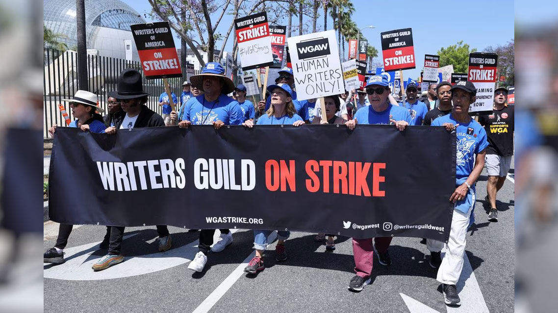 People attend a demonstration held by the Writers Guild of America as the film and TV writers' strike continues in Los Angeles, California, U.S., June 21, 2023. /Reuters