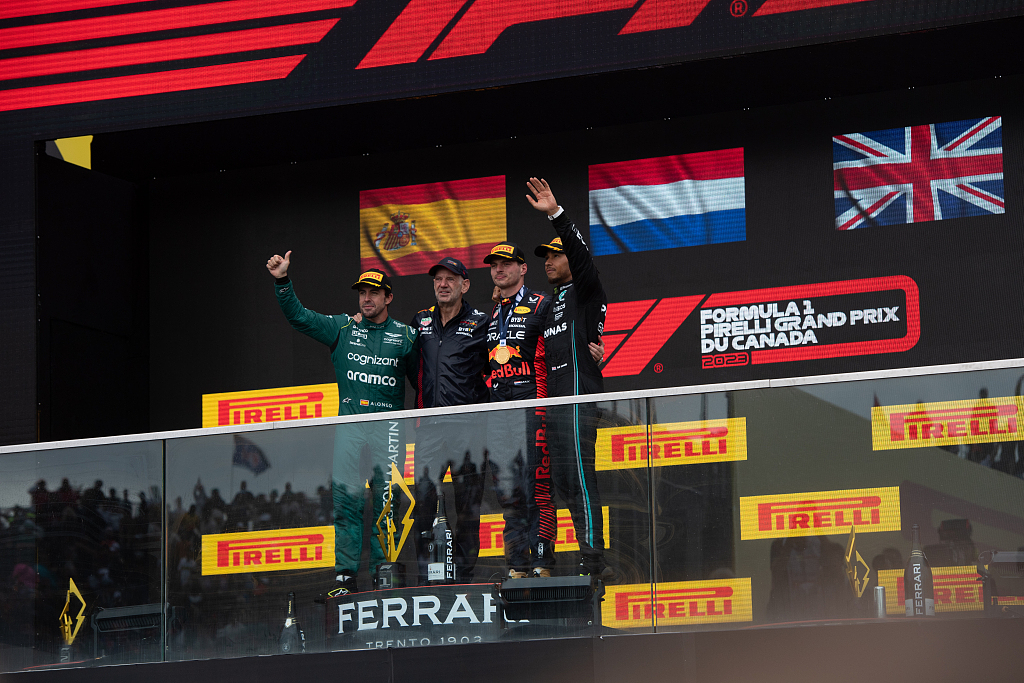 L-R: second-finished Fernando Alonso of Aston Martin, Red Bull racing chief technical officer Adrian Newey, race winner Max Verstappen of Red Bull, third-finished Lewis Hamilton of Mercedes AMG on the podium of the F1 Canadian Grand Prix in Montreal, Canada, June 18, 2023. /CFP