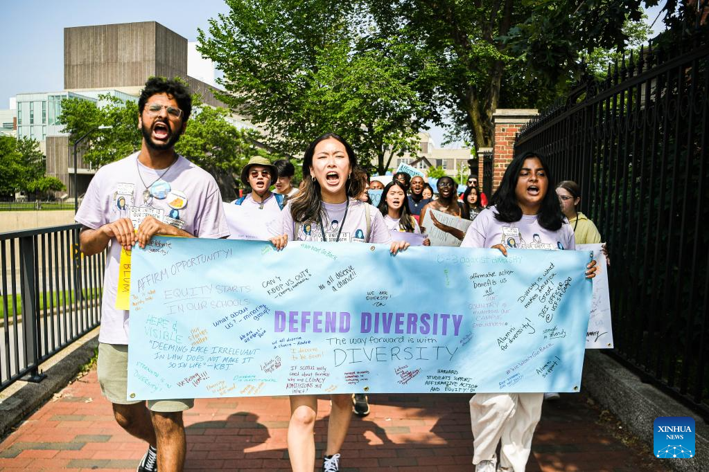 Participants march and chant slogans at a rally on Harvard University campus in Cambridge, Massachusetts on July 1, 2023 protesting the Supreme Court's ruling against affirmative action  /Xinhua
