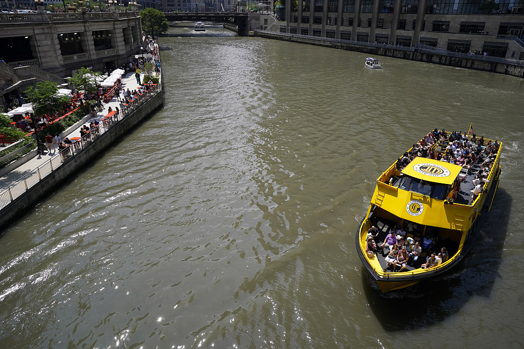 A water taxi is seen on the Chicago River in Chicago, a day after heavy rains flooded Chicago streets and neighborhoods, July 3, 2023. /CFP