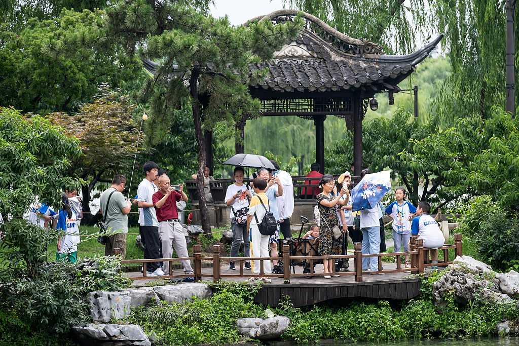 Tourists enjoy the weekend at Slender West Lake, in Yangzhou, Jiangsu Province, July 3, 2023. /CFP